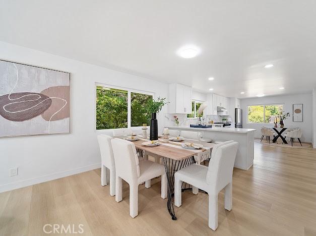 1050 Loma Verde Dr, Arcadia, CA 91006 - dining area with light wood-style floors and recessed lighting