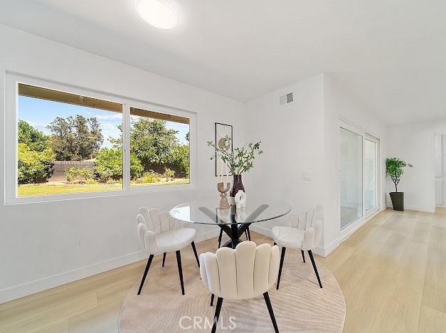 1050 Loma Verde Dr, Arcadia, CA 91006 - dining space with light wood finished floors and baseboards