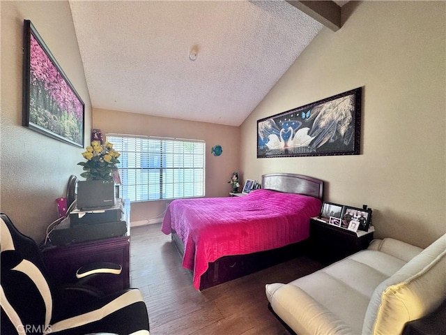 2532 W Macarthur Blvd Unit B, Santa Ana, CA 92704 - bedroom featuring vaulted ceiling, wood finished floors, and a textured ceiling