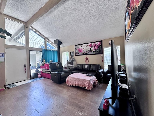 2532 W Macarthur Blvd Unit B, Santa Ana, CA 92704 - living area featuring a textured ceiling, wood-type flooring, and healthy amount of natural light
