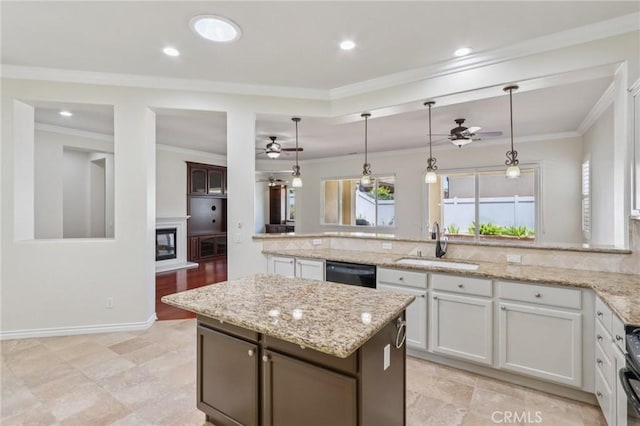 5136 Via Bajamar, Hemet, CA 92545 - kitchen featuring ceiling fan, black dishwasher, a glass covered fireplace, a peninsula, and light stone counters