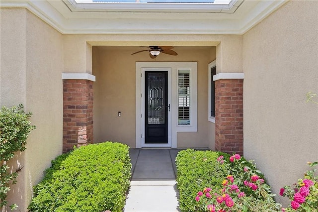 5136 Via Bajamar, Hemet, CA 92545 - view of exterior entry featuring stucco siding, a ceiling fan, and brick siding