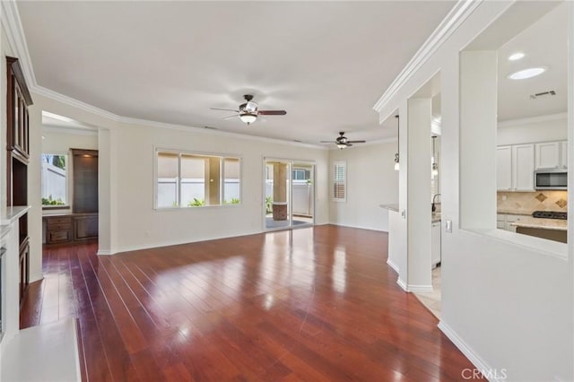 5136 Via Bajamar, Hemet, CA 92545 - unfurnished living room with a ceiling fan, wood finished floors, ornamental molding, recessed lighting, and a fireplace