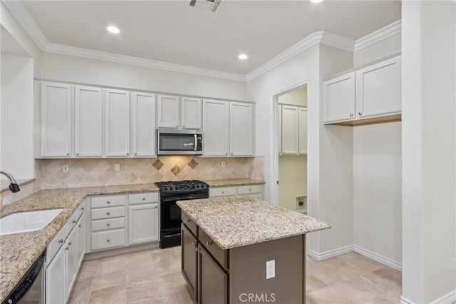 5136 Via Bajamar, Hemet, CA 92545 - kitchen with appliances with stainless steel finishes, decorative backsplash, light stone counters, recessed lighting, and ornamental molding
