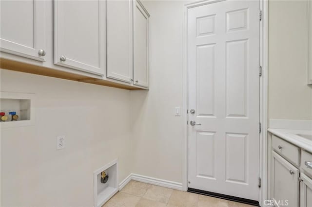 5136 Via Bajamar, Hemet, CA 92545 - laundry room with cabinet space, electric dryer hookup, washer hookup, and light tile patterned floors