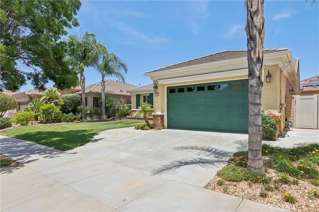 5136 Via Bajamar, Hemet, CA 92545 - ranch-style home featuring driveway, an attached garage, stucco siding, and a front lawn