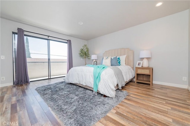 1223 S Golden W Ave Unit F, Arcadia, CA 91007 - bedroom with access to exterior, wood finished floors, and recessed lighting