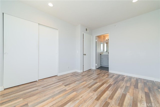 1223 S Golden W Ave Unit F, Arcadia, CA 91007 - unfurnished bedroom featuring light wood finished floors, a closet, recessed lighting, and connected bathroom