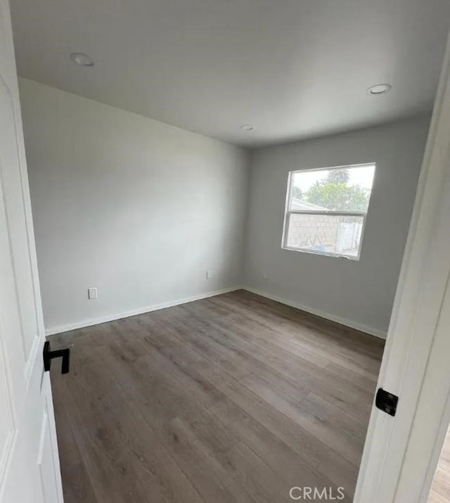 18134 Chase St, Northridge, CA 91325 - empty room with wood finished floors and recessed lighting