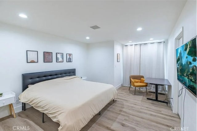 18134 Chase St, Northridge, CA 91325 - bedroom featuring light wood-type flooring and recessed lighting
