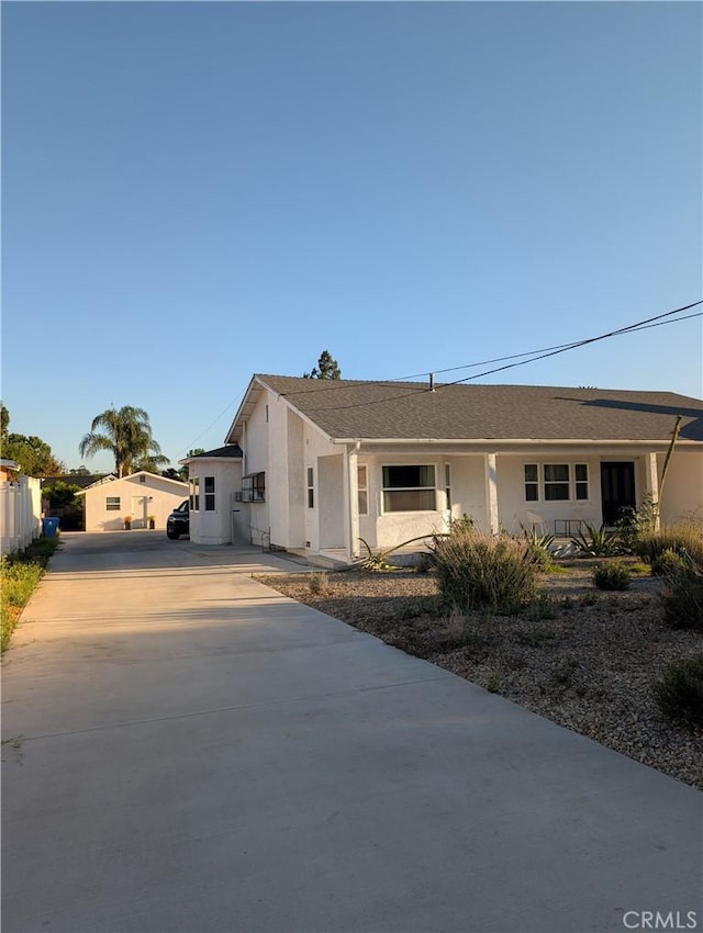 18134 Chase St, Northridge, CA 91325 - ranch-style house featuring concrete driveway, stucco siding, and a shingled roof