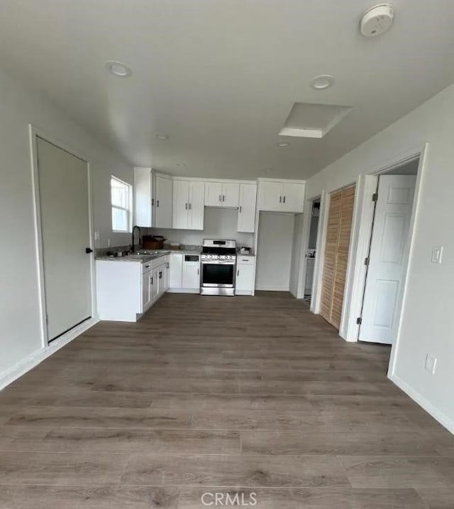 18134 Chase St, Northridge, CA 91325 - kitchen with stainless steel range, white cabinets, and dark wood-style flooring