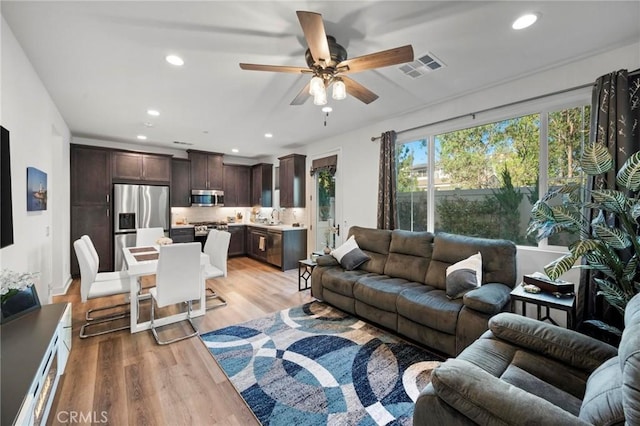 1742 Heywood St Unit C, Simi Valley, CA 93065 - living room with light wood-type flooring, a ceiling fan, and recessed lighting