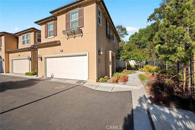 1742 Heywood St Unit C, Simi Valley, CA 93065 - view of front of home with an attached garage and stucco siding