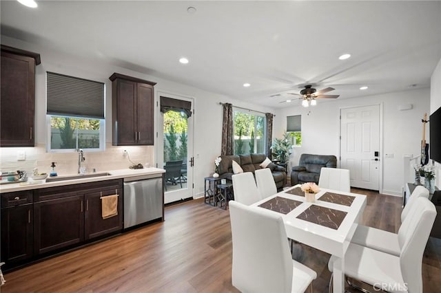 1742 Heywood St Unit C, Simi Valley, CA 93065 - kitchen with stainless steel dishwasher, open floor plan, dark brown cabinetry, recessed lighting, and tasteful backsplash