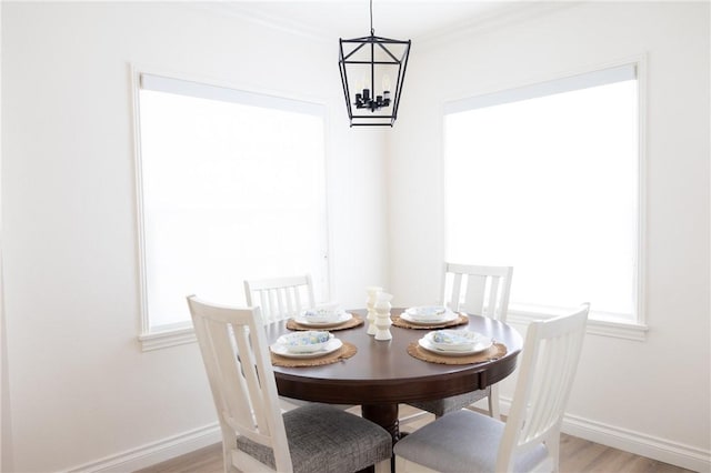 4622 Sunnyside Dr, Riverside, CA 92506 - dining area featuring light wood-style flooring and a chandelier
