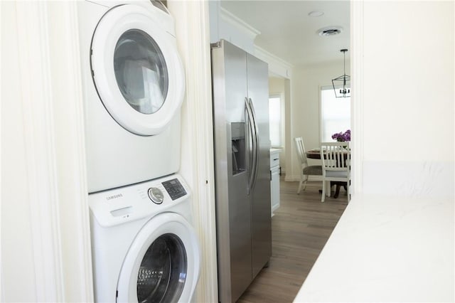 4622 Sunnyside Dr, Riverside, CA 92506 - laundry area featuring estacked washer and dryer and wood finished floors