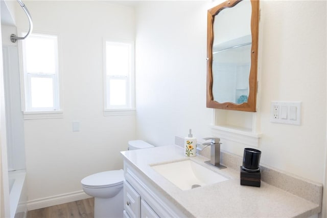 4622 Sunnyside Dr, Riverside, CA 92506 - bathroom with vanity, healthy amount of natural light, wood finished floors, and tub / shower combination
