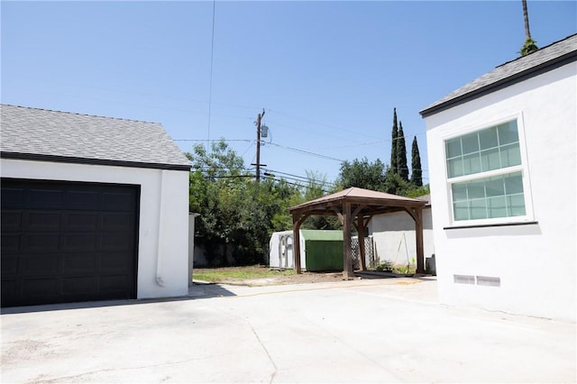 4622 Sunnyside Dr, Riverside, CA 92506 - garage featuring concrete driveway and a storage shed