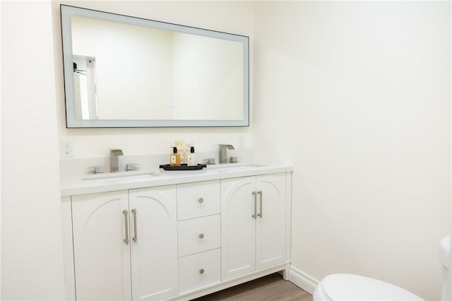 4622 Sunnyside Dr, Riverside, CA 92506 - bathroom featuring double vanity and wood finished floors