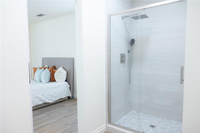 4622 Sunnyside Dr, Riverside, CA 92506 - bathroom with a stall shower, ensuite bathroom, and wood finished floors