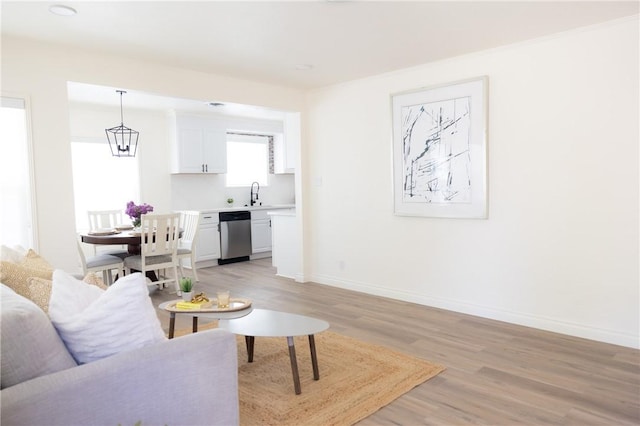 4622 Sunnyside Dr, Riverside, CA 92506 - living area featuring light wood-style flooring and baseboards