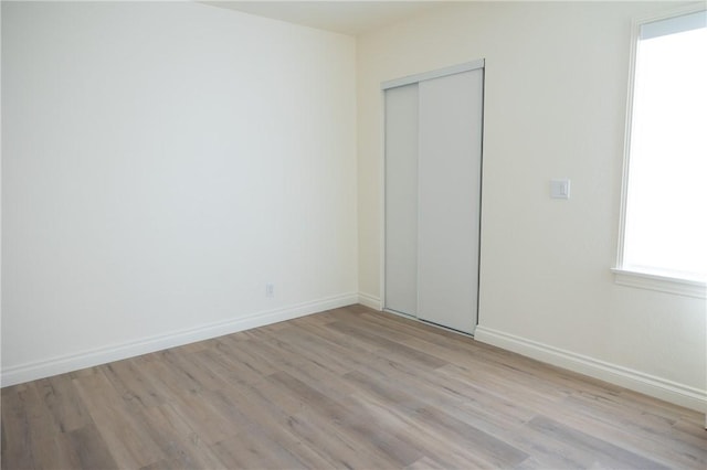 4622 Sunnyside Dr, Riverside, CA 92506 - unfurnished bedroom featuring light wood-type flooring and a closet