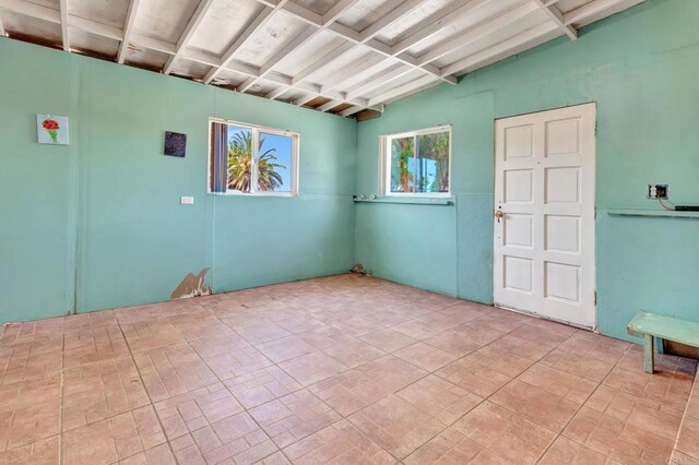 133 Lotus Dr, Chula Vista, CA 91911 - spare room featuring beamed ceiling