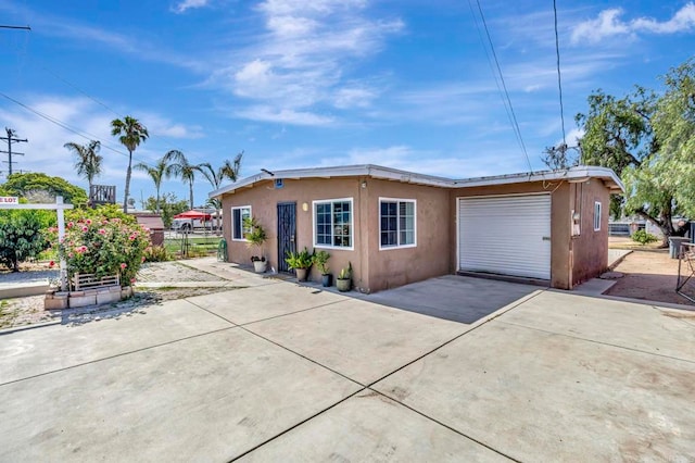 133 Lotus Dr, Chula Vista, CA 91911 - view of front of home with driveway, stucco siding, and a garage