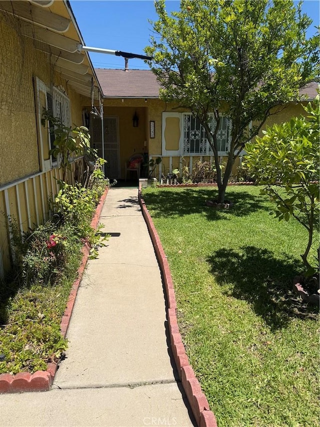 1740 N Del Norte Ave, Ontario, CA 91764 - entrance to property with a yard and stucco siding