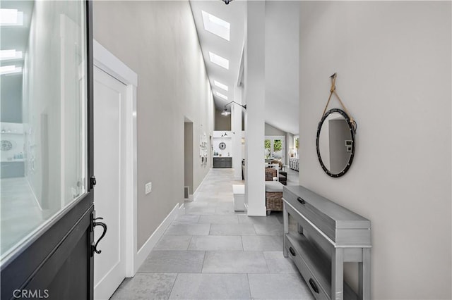 1119 Grove Ln, Newport Beach, CA 92660 - corridor with high vaulted ceiling and light tile patterned floors