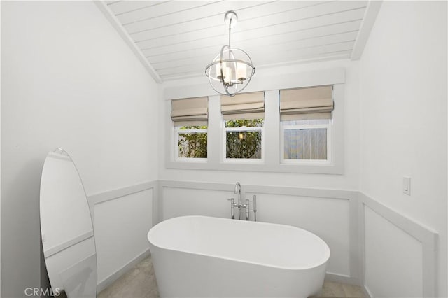 1119 Grove Ln, Newport Beach, CA 92660 - bathroom with a freestanding bath, a chandelier, wood ceiling, and a wainscoted wall