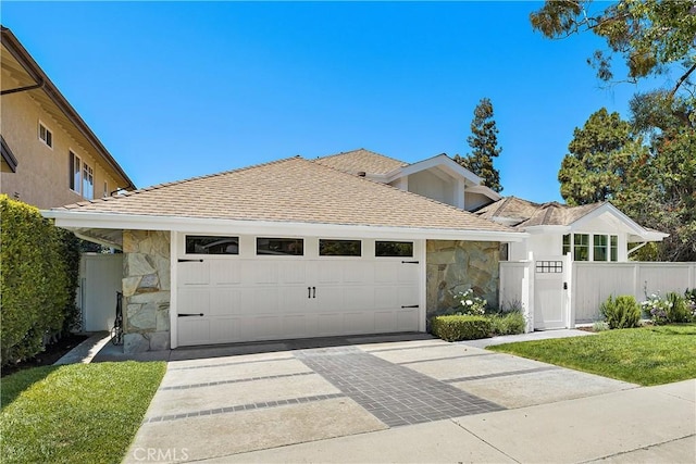 1119 Grove Ln, Newport Beach, CA 92660 - view of front of home with stone siding, concrete driveway, a garage, and a shingled roof
