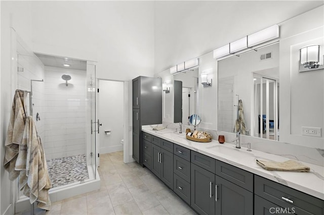 1119 Grove Ln, Newport Beach, CA 92660 - bathroom featuring double vanity, a stall shower, and a high ceiling