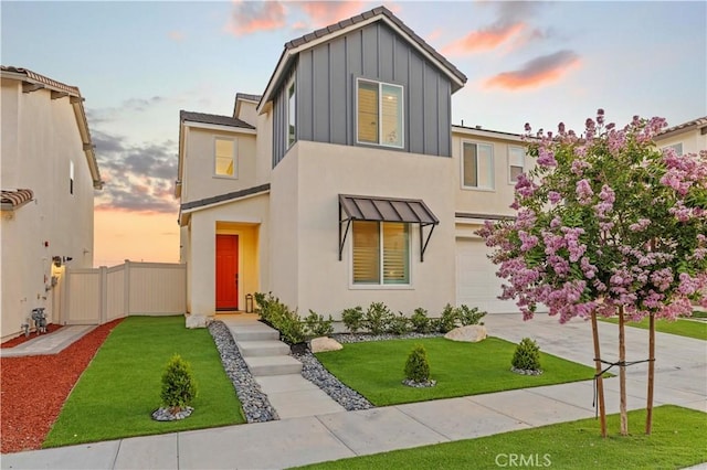 28537 Daybreak Way, Saugus, CA 91350 - view of front facade with board and batten siding, concrete driveway, stucco siding, and a garage