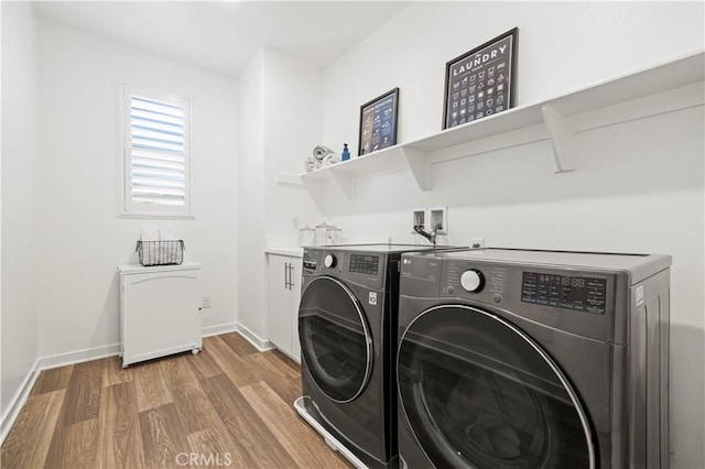 28537 Daybreak Way, Saugus, CA 91350 - washroom featuring washing machine and clothes dryer and light wood-style flooring