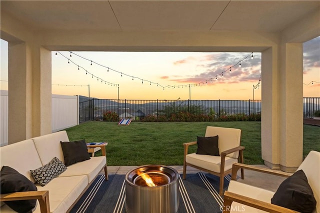 28537 Daybreak Way, Saugus, CA 91350 - patio terrace at dusk with an outdoor living space with a fire pit, a fenced backyard, and a patio
