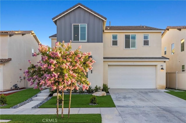 28537 Daybreak Way, Saugus, CA 91350 - view of front of home featuring board and batten siding, concrete driveway, and an attached garage