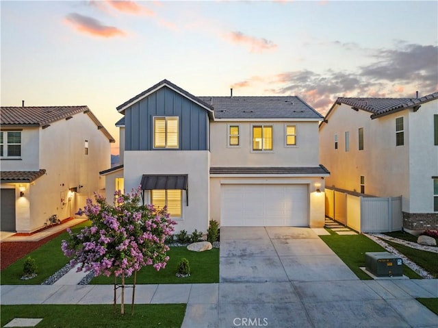 28537 Daybreak Way, Saugus, CA 91350 - view of front facade featuring driveway, an attached garage, stucco siding, and board and batten siding