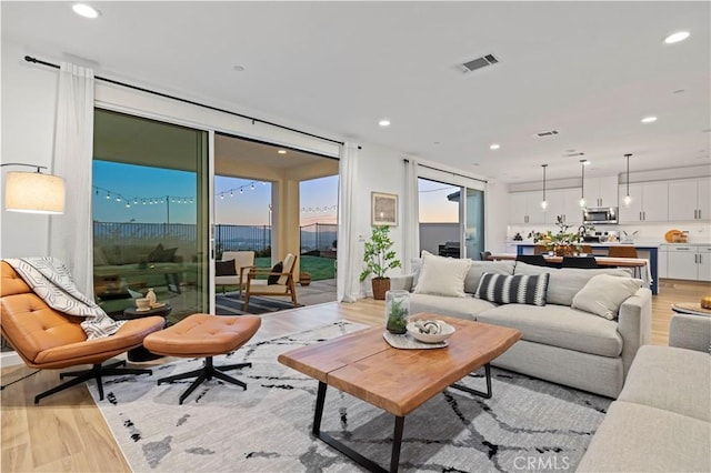 28537 Daybreak Way, Saugus, CA 91350 - living area with light wood finished floors, recessed lighting, and expansive windows