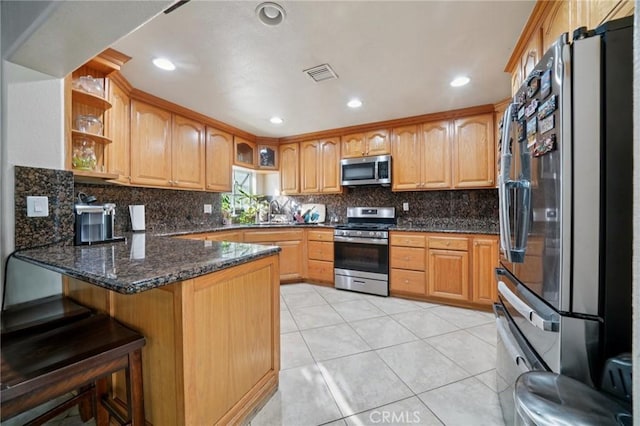 4435 Los Serranos Blvd, Chino Hills, CA 91709 - kitchen with stainless steel appliances, a peninsula, decorative backsplash, open shelves, and dark stone counters