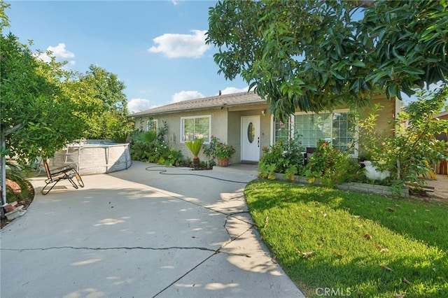 4435 Los Serranos Blvd, Chino Hills, CA 91709 - view of front facade with stucco siding and a patio