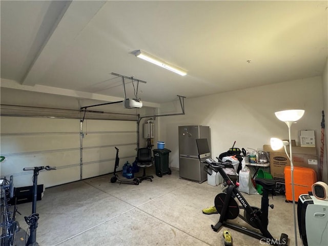 3249 E Butterfly Ln, Ontario, CA 91762 - garage with freestanding refrigerator and a garage door opener