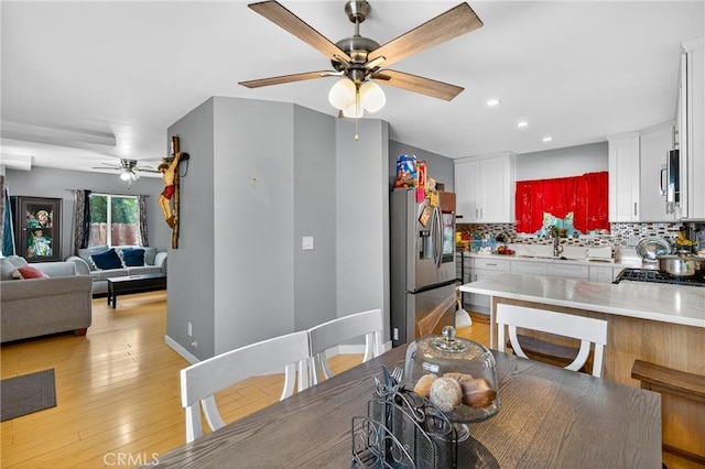 8627 John Ave, Los Angeles, CA 90002 - dining space with ceiling fan, recessed lighting, and light wood-type flooring
