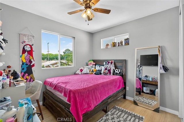 8627 John Ave, Los Angeles, CA 90002 - bedroom featuring wood finished floors and ceiling fan
