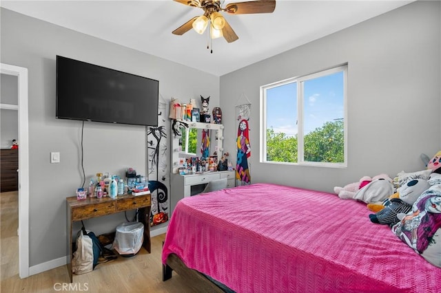 8627 John Ave, Los Angeles, CA 90002 - bedroom with wood finished floors and a ceiling fan