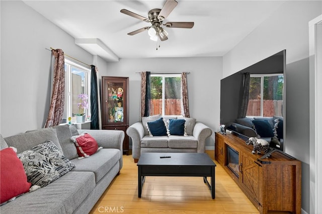 8627 John Ave, Los Angeles, CA 90002 - living area featuring light wood-type flooring and ceiling fan