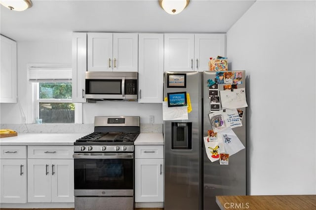 8627 John Ave, Los Angeles, CA 90002 - kitchen with stainless steel appliances, white cabinets, and light countertops