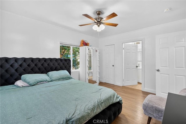 8627 John Ave, Los Angeles, CA 90002 - bedroom with wood finished floors, ornamental molding, and a ceiling fan
