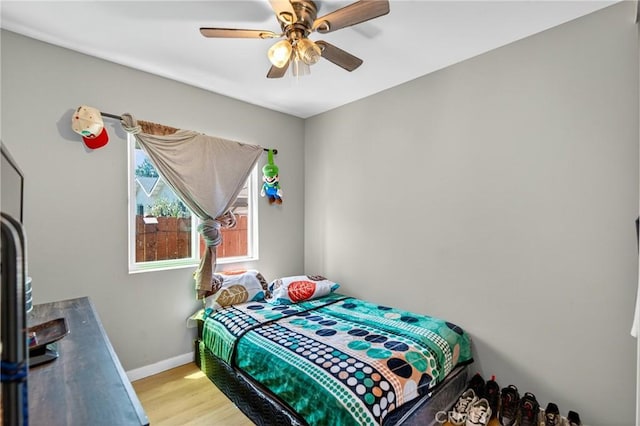 8627 John Ave, Los Angeles, CA 90002 - bedroom featuring light wood finished floors and ceiling fan